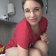 An attractive German girl wearing glasses takes a quick, but plentiful, soft shit on a hotel room floor while bending over. Presented in 720P HD. Over half a minute.